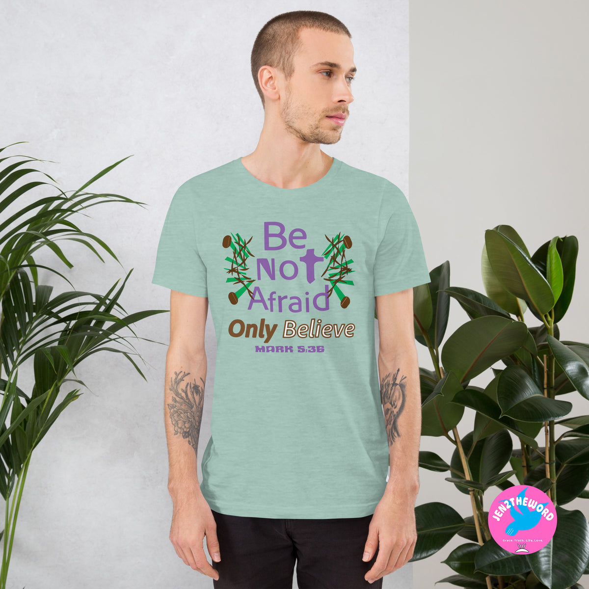 Male wearing a Heather Prism Dusty Blue Christian unisex t-shirt for teens, men and women be not afraid