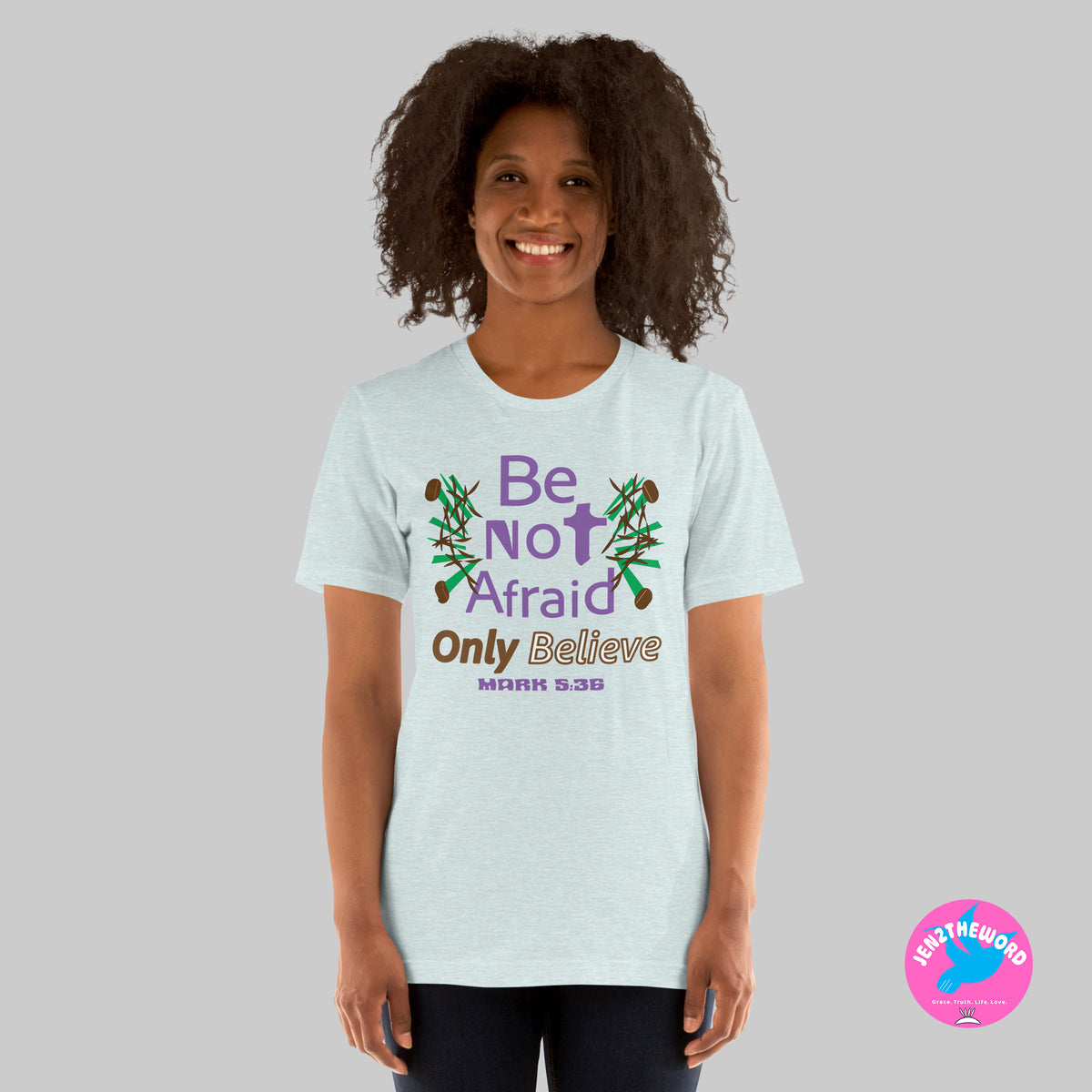 Female wearing a Heather Prism Ice Blue Christian unisex t-shirt for teens, men and women be not afraid