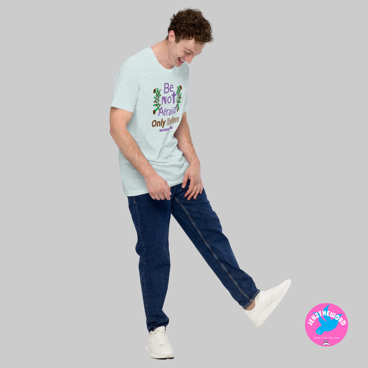 Male wearing a Heather Prism Ice Blue Christian unisex t-shirt for teens, men and women be not afraid