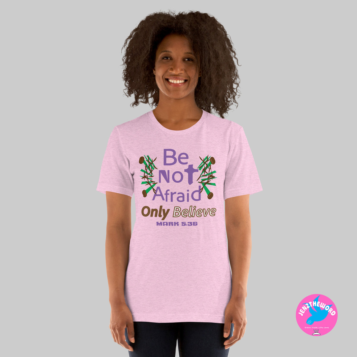 Female wearing a Heather Prism Lilac Christian unisex t-shirt for teens, men and women be not afraid