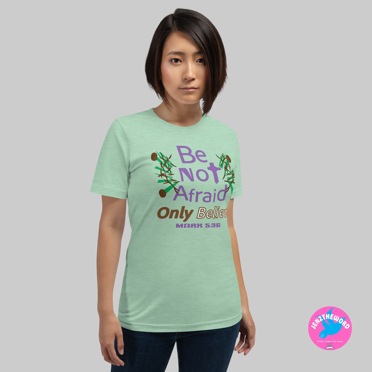 Female wearing a Heather Prism Mint Christian unisex t-shirt for teens, men and women be not afraid