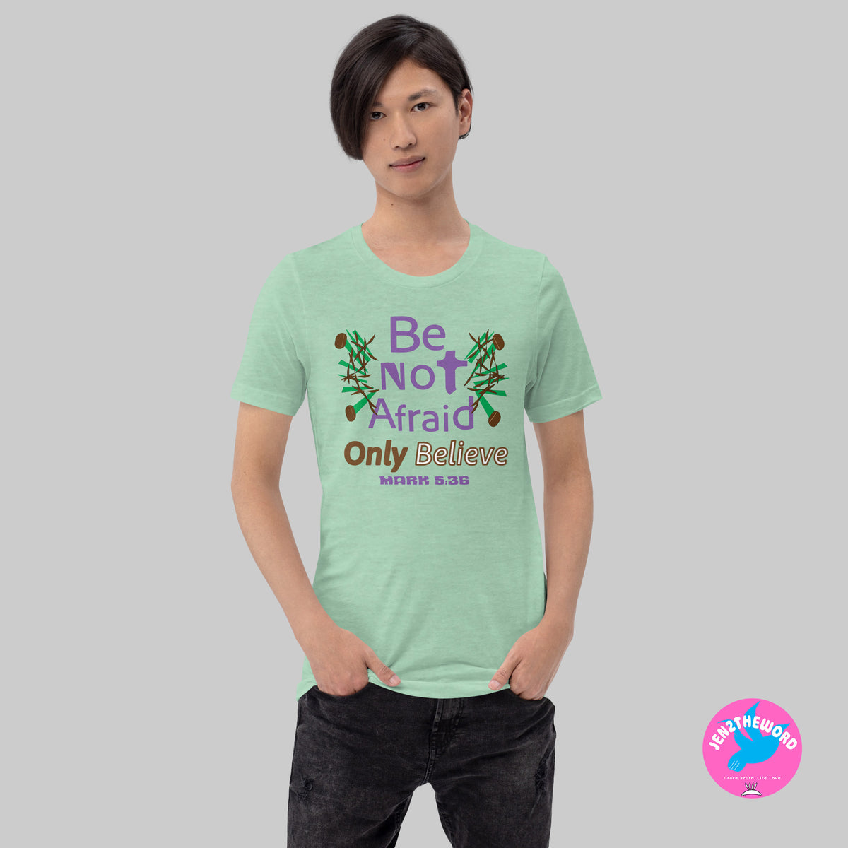Male wearing a Heather Prism Mint Christian unisex t-shirt for teens, men and women be not afraid